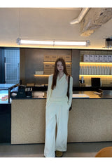 Flower brooch striped long-sleeved knit shirt