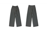 Black loose straight-leg suit pants with a drape effect