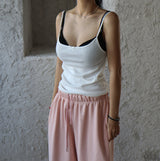 a ribbon-punching sleeveless shirt