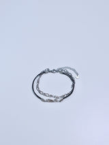 All surgical seel new wave layered string bracele