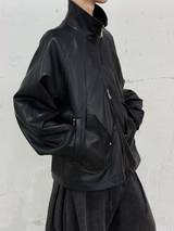 RELABEL Spatial Relations (Vietnam) Deconstructed, segmented, concealed multi-layering Multi-pocket silhouette leather jacket