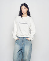 25FW WOMAN ラウンドフォントレタリングクロップスウェット クリーム