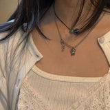 tooth piercing necklace