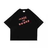 フェイクナッツ ステイン メイド イン アスタリスク ブラック ボクシー オーバーサイズ Tシャツ