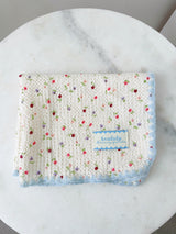 Floral table mat light blue accents