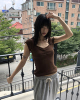 ハートネックパンチングキャップスリーブシャーリング半袖Tシャツ