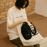 DAKYAM 2025S/S デアトゥードリームロゴプリンティングTシャツ
