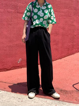 Black loose straight-leg suit pants with a drape effect