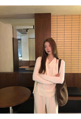 Flower brooch striped long-sleeved knit shirt