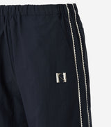 Newalrin エンブレムナイロンワイドパンツ