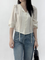 Leche Strap Button Long Sleeve Blouse
