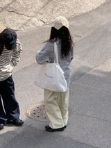 a light striped sweatshirt, grey