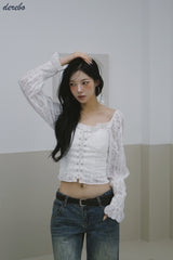 daisy punching strap frill blouse