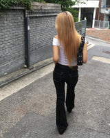 Black stitch boots cut pants