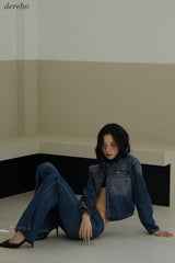 Round medium blue zip-up denim jacket