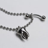 tooth piercing necklace