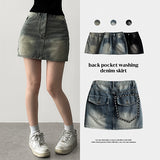 Nizu washing snap pocket denim miniskirt