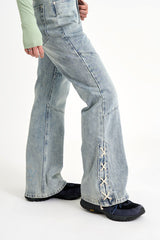 Sage cross lace denim pants