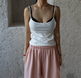 a ribbon-punching sleeveless shirt