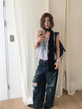 Dirty washed destroyed denim pants