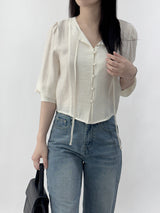 Leche Strap Button Long Sleeve Blouse