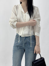 Leche Strap Button Long Sleeve Blouse