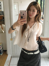 Cascade ruffle blouse