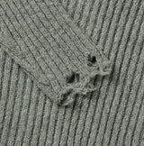 Reverse damage V-neck knitwear