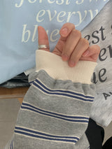 a light striped sweatshirt, grey
