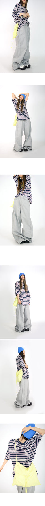 over wide gray pants