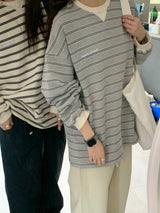 a light striped sweatshirt, grey