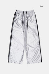 Bright glossy track pants