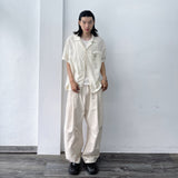 スカルプテッド ニー ワイドパンツ