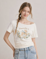 ダイアサマーヴィンテージグラフィックシャーリングワンショルダーTシャツ アイボリー
