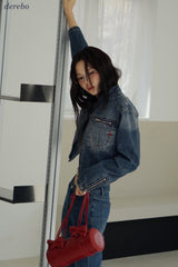Round medium blue zip-up denim jacket