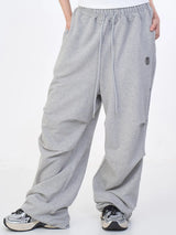 SIDE RIVET THUNDER LOGO PARACHUTE SWEAT PANTS