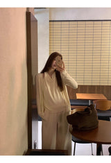 Flower brooch striped long-sleeved knit shirt