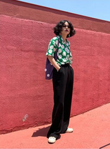 Black loose straight-leg suit pants with a drape effect