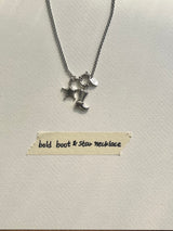 Bold boots and star necklace