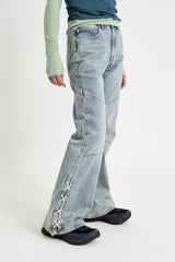 Sage cross lace denim pants