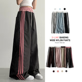 Vito coloring nylon three-line track line wide pants