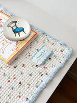Floral table mat light blue accents