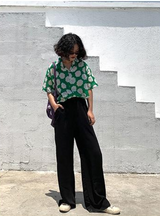 Black loose straight-leg suit pants with a drape effect