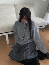 ジュークディアゴナルボタンハイネックニット