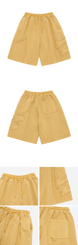 24FW APPLIQUE LOGO PIGMENT SHORT PANTS LIGHT YELLOW
