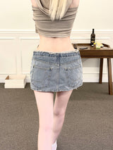 1328. Blue shark denim cut out low mini sk