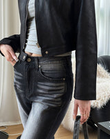 Black cat washing boots cut pants
