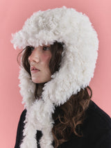 KNOT EARFLAP HAT IN FURRY CREAM