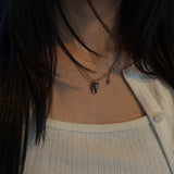 tooth piercing necklace