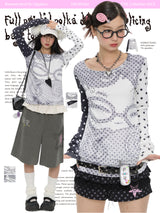 BETWEENAND Long-sleeved women’s top for spring, with a pixelated anime-style polka dot design; helps to slim the figure